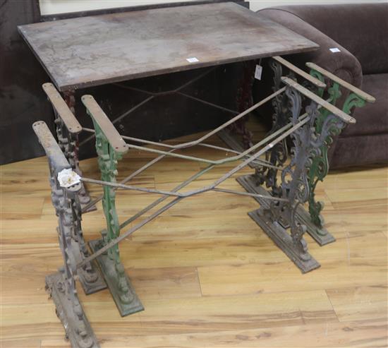 A set of four cast iron base tables, with rectangular tops, H.68cm